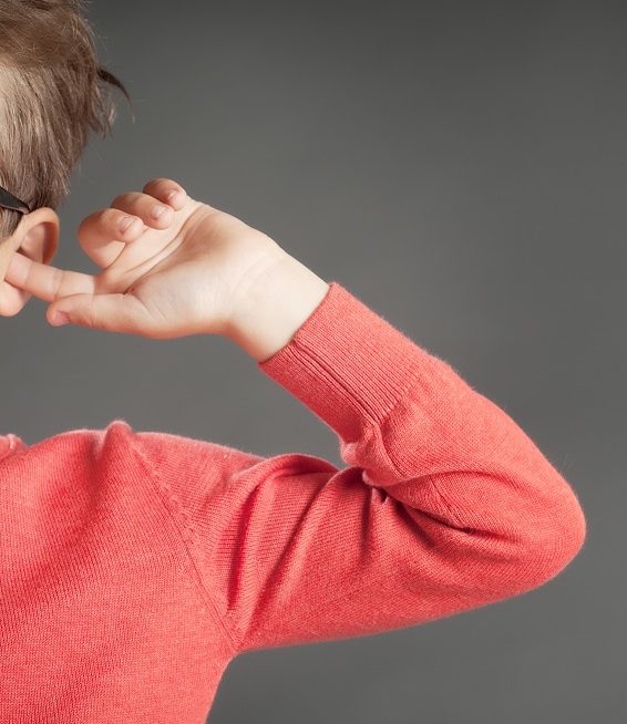 kid kept his finger on his hear and dont want to listen